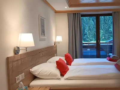 Ein Bett oder Betten in einem Zimmer der Unterkunft Haus Huber Zimmer und Apartments