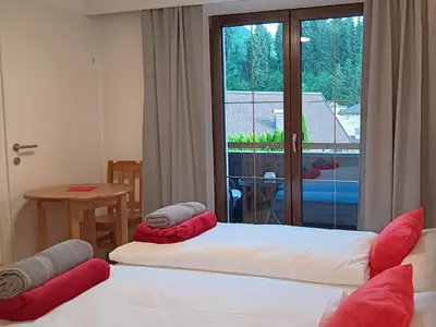 Ein Bett oder Betten in einem Zimmer der Unterkunft Haus Huber Zimmer und Apartments