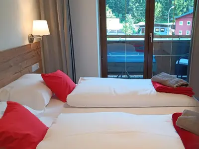 Ein Bett oder Betten in einem Zimmer der Unterkunft Haus Huber Zimmer und Apartments