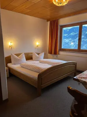 Ein Bett oder Betten in einem Zimmer der Unterkunft Ferienwohnung Schwendberg