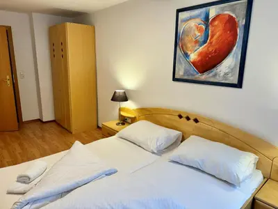 Ein Bett oder Betten in einem Zimmer der Unterkunft Alpenlodge, Ferienwohnung 7