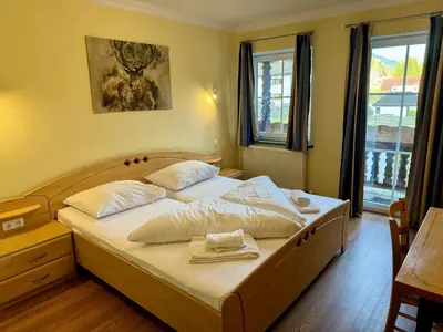 Ein Bett oder Betten in einem Zimmer der Unterkunft Alpenlodge, Ferienwohnung 7