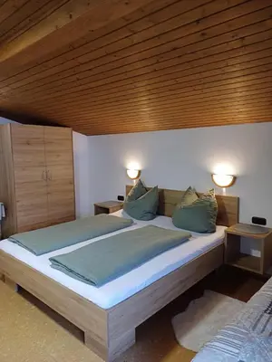 Ein Bett oder Betten in einem Zimmer der Unterkunft Frandlhof