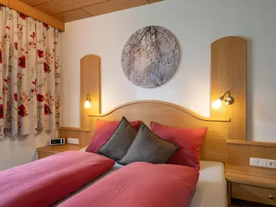 Ein Bett oder Betten in einem Zimmer der Unterkunft Apartment Daniela-4 by Interhome
