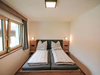 Ein Bett oder Betten in einem Zimmer der Unterkunft Apartment Familienglück by Interhome
