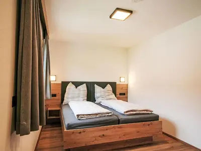Ein Bett oder Betten in einem Zimmer der Unterkunft Apartment Familienglück by Interhome