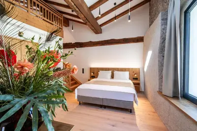 Ein Bett oder Betten in einem Zimmer der Unterkunft Hotel Traube Rattenberg