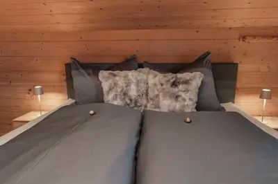 Ein Bett oder Betten in einem Zimmer der Unterkunft Ferienwohnung Holzegger