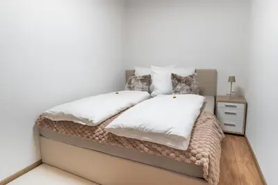 Ein Bett oder Betten in einem Zimmer der Unterkunft Ferienwohnung Holzegger
