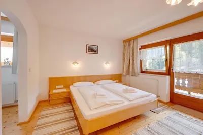 Ein Bett oder Betten in einem Zimmer der Unterkunft Ferienhaus Hirschalmblick