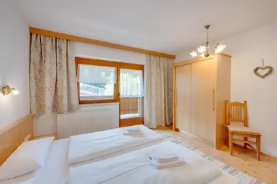 Ein Bett oder Betten in einem Zimmer der Unterkunft Ferienhaus Hirschalmblick