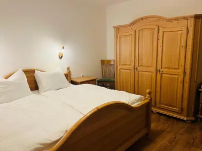 Ein Bett oder Betten in einem Zimmer der Unterkunft Ferienwohnung Ingrid Hörbiger