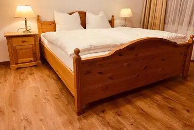 Ein Bett oder Betten in einem Zimmer der Unterkunft Ferienwohnung Ingrid Hörbiger