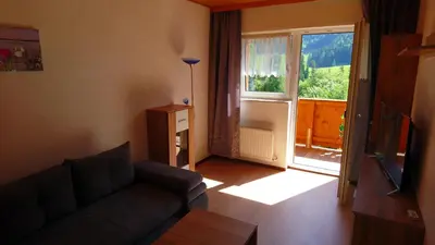 Ein Sitzbereich in der Unterkunft Obereinschneithof