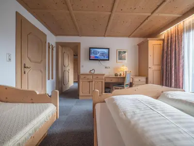 Ein Bett oder Betten in einem Zimmer der Unterkunft Ferienwohnungen Egger