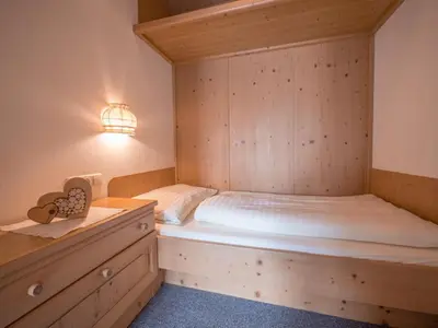 Ein Bett oder Betten in einem Zimmer der Unterkunft Ferienwohnungen Egger