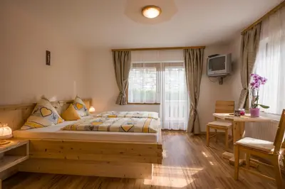 Ein Bett oder Betten in einem Zimmer der Unterkunft Gästehaus Rahm - Familie Wechselberger