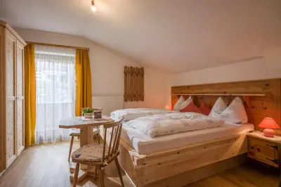 Ein Bett oder Betten in einem Zimmer der Unterkunft Gästehaus Rahm - Familie Wechselberger