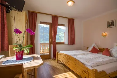Ein Bett oder Betten in einem Zimmer der Unterkunft Gästehaus Rahm - Familie Wechselberger