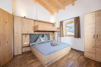Ein Bett oder Betten in einem Zimmer der Unterkunft BEIM LOIS Isskogelblick - by AlpenLuxus Collection