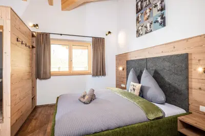 Ein Bett oder Betten in einem Zimmer der Unterkunft BEIM LOIS Isskogelblick - by AlpenLuxus Collection