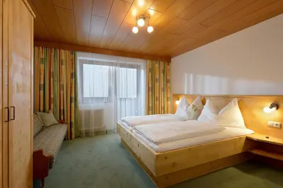 Ein Bett oder Betten in einem Zimmer der Unterkunft Landhaus Victoria