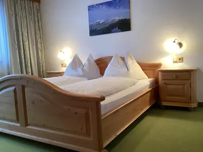 Ein Bett oder Betten in einem Zimmer der Unterkunft Landhaus Victoria