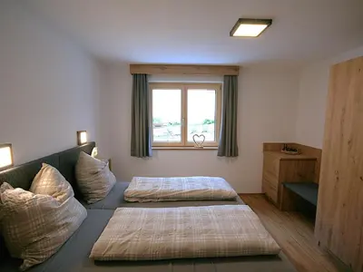 Ein Bett oder Betten in einem Zimmer der Unterkunft Apartment Hohe Salve by Interhome