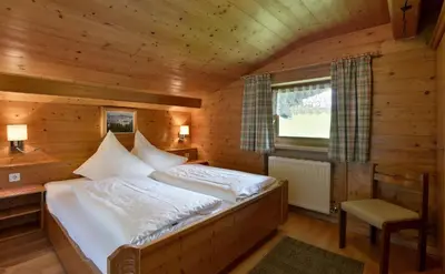 Ein Bett oder Betten in einem Zimmer der Unterkunft Gästehaus Hölzl