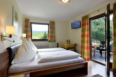 Ein Bett oder Betten in einem Zimmer der Unterkunft Gästehaus Hölzl