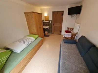 Ein Sitzbereich in der Unterkunft Ferienwohnung Farbmacher