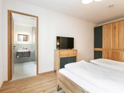 Ein Bett oder Betten in einem Zimmer der Unterkunft Hopfgarten Alpin Living Top 3 und 4