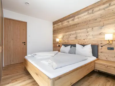 Ein Bett oder Betten in einem Zimmer der Unterkunft Hopfgarten Alpin Living Top 4