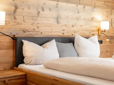 Ein Bett oder Betten in einem Zimmer der Unterkunft Hopfgarten Alpin Living Top 4