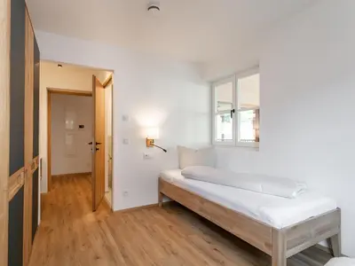 Ein Bett oder Betten in einem Zimmer der Unterkunft Hopfgarten Alpin Living Top 3