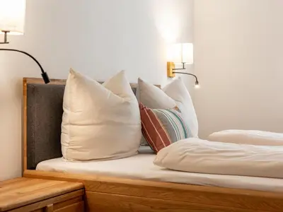 Ein Bett oder Betten in einem Zimmer der Unterkunft Hopfgarten Alpin Living Top 1