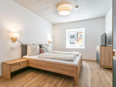 Ein Bett oder Betten in einem Zimmer der Unterkunft Hopfgarten Alpin Living Top 1