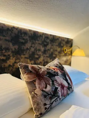 Ein Bett oder Betten in einem Zimmer der Unterkunft DAHUAM SUITES GERLOS Ski in Appartements mit BalkonITerrasse