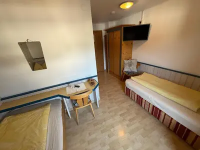 Ein Bett oder Betten in einem Zimmer der Unterkunft Pension Rainer