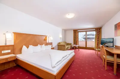 Ein Bett oder Betten in einem Zimmer der Unterkunft Alpenhotel Ramsauerhof