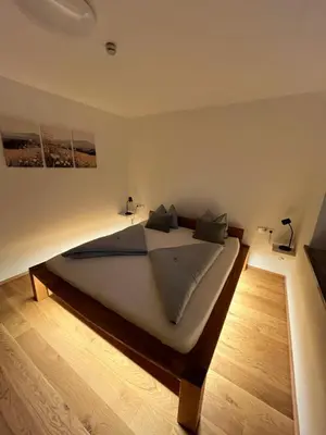 Ein Bett oder Betten in einem Zimmer der Unterkunft AlpineHome Apartments Walchsee
