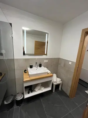 Ein Badezimmer in der Unterkunft AlpineHome Apartments Walchsee
