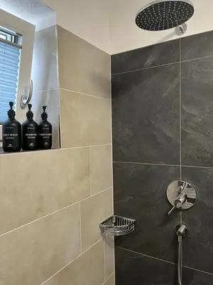 Ein Badezimmer in der Unterkunft AlpineHome Apartments Walchsee