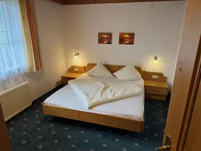 Ein Bett oder Betten in einem Zimmer der Unterkunft Schönmoosalm