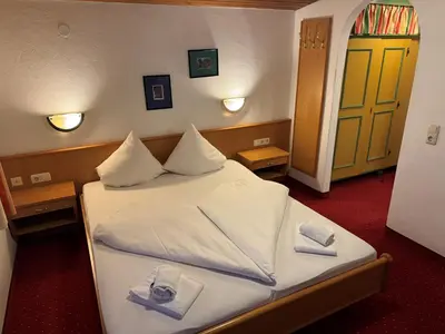 Ein Bett oder Betten in einem Zimmer der Unterkunft Schönmoosalm