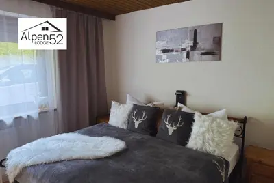 Ein Bett oder Betten in einem Zimmer der Unterkunft Ferienwohnung Alpenlodge 52