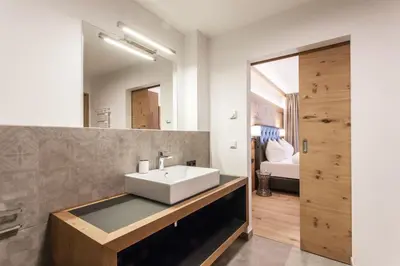 Ein Bett oder Betten in einem Zimmer der Unterkunft Hubertus Apartments