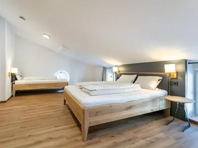 Ein Bett oder Betten in einem Zimmer der Unterkunft Hopfgarten Alpin Living Top 6
