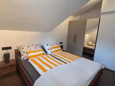 Ein Bett oder Betten in einem Zimmer der Unterkunft Resi's Kitz Lodge