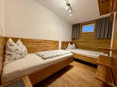 Ein Bett oder Betten in einem Zimmer der Unterkunft Ferienwohnung Seethaler - Gartenblick